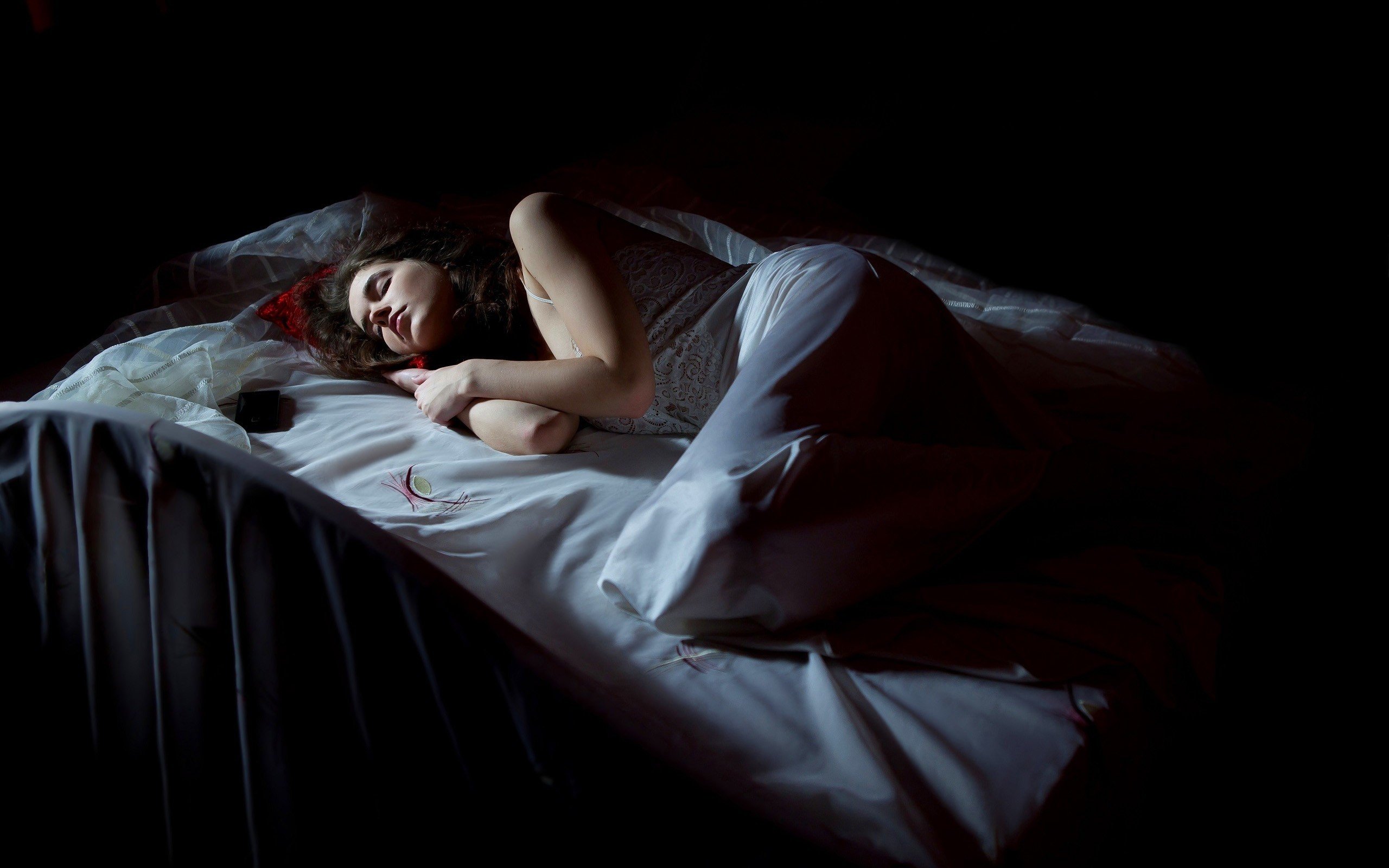 women, Model, Brunette, Long hair, White dress, Sleeping, Closed eyes, In bed, Black background Wallpaper