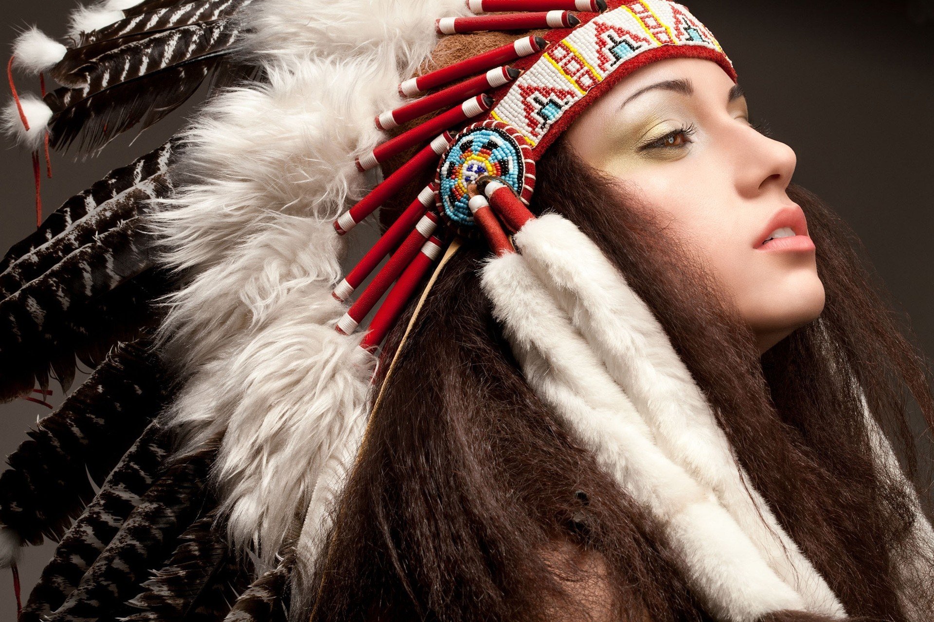 women, Model, Long hair, Face, Feathers, Native Americans, Brunette, Makeup, Brown eyes, Open mouth, Simple background, Headdress Wallpaper