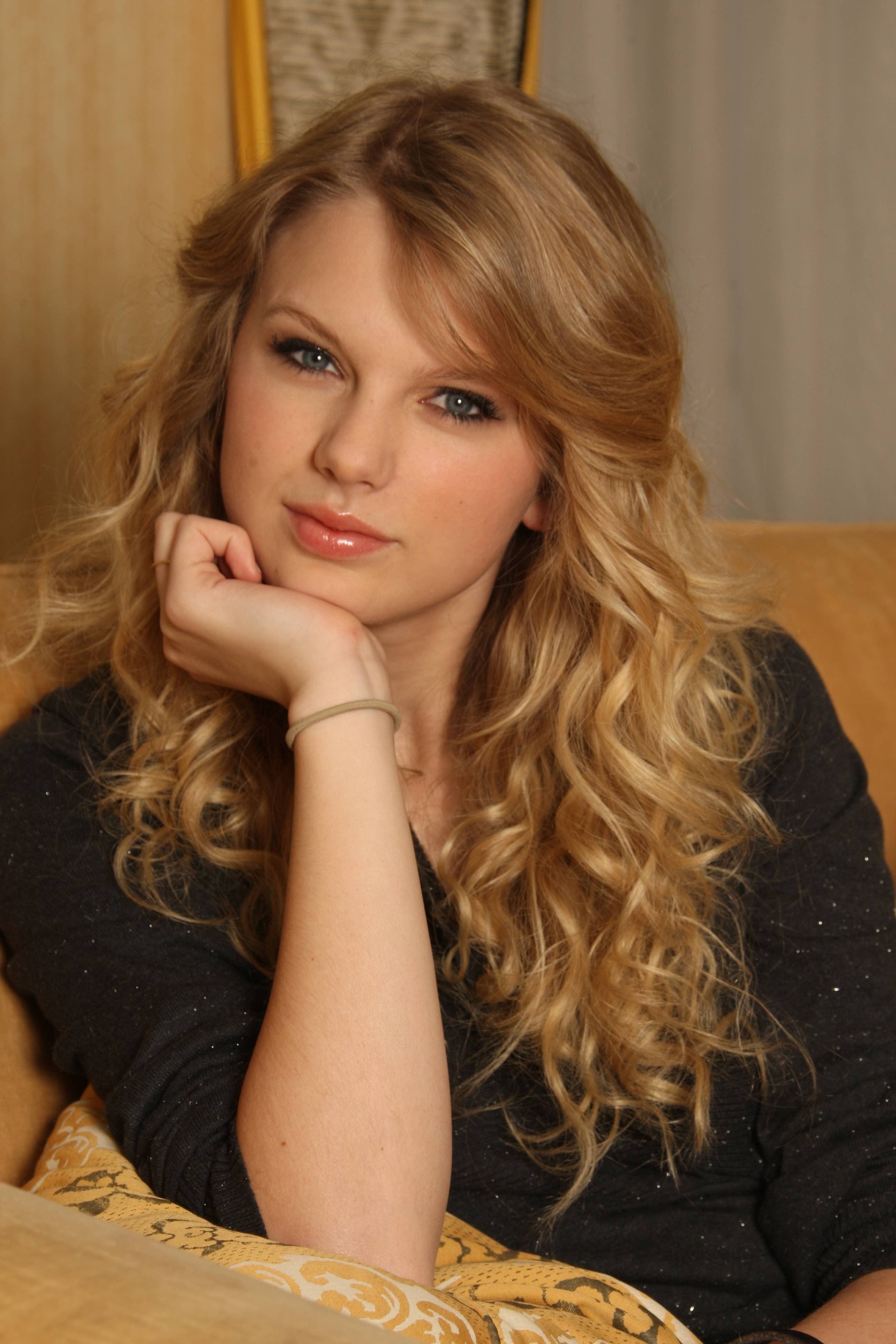 girl with curly blonde hair and blue eyes