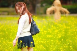 women, Model, Redhead, Long hair, Asian, Closed eyes, Women outdoors, Nature, Field, Yellow flowers, Sweater, Bag, Short skirt, Park